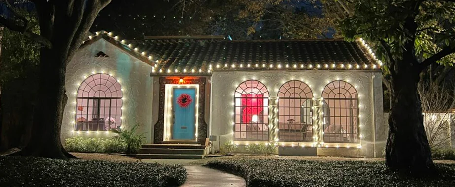 Front yard with colorful Christmas lights and decorations